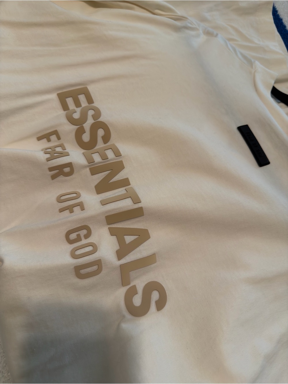 Fear of God Essentials Short Sleeve Tee in Cream with Tan Logo